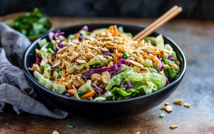 # Easy & Flavorful Chinese Chicken Salad ## Introduction This **Chinese chicken salad** is the kind of meal that hits all the right notes—crunchy, savory, bright, and just a little bit spicy. Packed with fresh veggies, tender shredded rotisserie chicken, and topped with crispy wonton strips and a zippy Asian-inspired dressing, this salad is not only delicious but a breeze to put together. I first made this on a hot summer day when cooking felt impossible—and let me tell you, it’s been a weekly go-to ever since. It’s perfect as a meal-prep lunch, a potluck showstopper, or a satisfying dinner that doesn’t weigh you down. Whether you’re looking for a quick dinner or planning meals ahead, this salad fits beautifully into your lineup. It’s also a great option for anyone trying to eat a little lighter without sacrificing flavor. If you love recipes that are both effortless and mouthwateringly good, you’re going to adore this one. ## Why You’ll Love This Recipe ### Key Benefits - **Quick and fuss-free** – With pre-cooked rotisserie chicken and bagged veggies, this salad is ready in just 15 minutes. - **No cooking required** – Perfect for hot days or busy nights. - **Meal-prep friendly** – Store ingredients separately and toss together when you’re ready to eat. - **Crowd-pleaser** – Great for gatherings, BBQs, or weeknight dinners. ### Taste & Texture Every bite is a harmony of textures and flavors—crunchy lettuce and cabbage, juicy chicken, sweet and tangy dressing, and crispy wonton strips. The sesame seeds and slivered almonds add nuttiness and depth, while the optional red pepper flakes give it a gentle kick. ### Dietary Attributes This recipe is naturally gluten-free (just be sure your wonton strips and dressing are certified GF) and loaded with lean protein and fiber-rich veggies. You can easily adapt it for low-carb or dairy-free diets. ## Ingredients & Substitutions ### Ingredient List - 2 cups rotisserie chicken breast, shredded - 1 head romaine lettuce, shredded - 1 head iceberg lettuce, shredded - 1 cup shredded red cabbage - 1 cup shredded carrots - 1/4 cup green onions, thinly sliced - 3 tablespoons chopped cilantro (optional) - 1 pinch crushed red pepper flakes - 1 tablespoon sesame seeds - 1/2 cup slivered almonds - 1 cup crispy wonton strips - Asian salad dressing (store-bought or homemade) ### Notes on Quality Fresh is best when it comes to the veggies. If you can, use freshly shredded lettuce and cabbage for the ultimate crunch. Pre-shredded bags are totally fine in a pinch. I like to use rotisserie chicken because it’s quick, flavorful, and super tender—plus, it's a budget-friendly shortcut. ### Possible Substitutions - **Lettuce:** Try Napa cabbage or baby spinach for a twist. - **Chicken:** Use grilled chicken breast, leftover turkey, or even tofu for a vegetarian version. - **Dressing:** A sesame-ginger vinaigrette or peanut dressing works beautifully too. - **Toppings:** Swap wonton strips for chow mein noodles, sunflower seeds, or even crushed ramen noodles for extra crunch. ## Step-by-Step Instructions 1. In a large bowl, add shredded rotisserie chicken. Drizzle with half of your Asian dressing and toss until evenly coated. Let sit for 10 minutes so the flavors soak in. 2. Add shredded romaine, iceberg, red cabbage, carrots, green onions, and cilantro (if using) to the bowl. Gently toss everything together. 3. Right before serving, pour in the remaining dressing and toss again to coat. 4. Sprinkle with crushed red pepper flakes, sesame seeds, slivered almonds, and crispy wonton strips. 5. Serve immediately while the salad and toppings are at peak crunchiness. ## Expert Tips & Tricks ### Best Practices - Always dress your salad right before serving to keep it crisp. - Toast your slivered almonds in a dry skillet for 2-3 minutes to bring out their flavor. - If you're making a homemade dressing, add garlic and ginger just before serving for the freshest taste. ### Common Mistakes - Don’t overdress the salad—start with less and add more as needed. - Avoid using warm chicken; let it cool first so it doesn’t wilt the greens. - Be cautious with the red pepper flakes—just a pinch goes a long way. ### Time-Saving Tips - Use pre-shredded coleslaw mix instead of chopping red cabbage and carrots separately. - Buy bagged lettuce and pre-cooked chicken for a lightning-fast assembly. - Prep the dressing and chop veggies in advance for a DIY salad kit-style lunch or dinner. ## Serving Suggestions ### Pairings This salad is super versatile. Pair it with: - Steamed edamame or dumplings for a complete meal - A bowl of miso soup or light veggie soup - Fresh fruit like pineapple or mango slices on the side ### Presentation Ideas Serve this salad in a wide, shallow bowl for a stunning display. Layer the veggies and chicken first, then drizzle the dressing and finish with a generous sprinkle of toppings. A few sprigs of cilantro or scallions on top make it extra inviting. ### Beverage Pairings - **Non-alcoholic:** Try iced green tea or sparkling water with lemon - **Cocktail:** A light sake spritzer or ginger mojito complements the Asian flavors - **Wine:** A crisp white wine like Sauvignon Blanc or Riesling works beautifully ## Storage & Reheating ### Leftover Storage Store all components separately in airtight containers or zip-top bags: - Shredded chicken: up to 3 days in the fridge - Chopped lettuce and veggies: up to 5 days - Dressing: 2-3 days (or longer without fresh garlic/ginger) If you’re prepping for the week, create your own DIY salad kit just like those popular store-bought ones. Keep the crunchy toppings in a separate container to maintain texture. ### Reheating Methods This salad is best enjoyed cold or at room temperature. No reheating needed—just toss and go! ## Frequently Asked Questions ### Substitutions & Adjustments **Can I use grilled chicken instead of rotisserie?** Yes! Grilled chicken works great. Just be sure to let it cool before tossing it into the salad. **Is there a vegetarian version?** Absolutely. Swap the chicken for crispy tofu, chickpeas, or even edamame for plant-based protein. ### Troubleshooting **My salad got soggy—what happened?** It was likely dressed too early. Always wait to add dressing until just before serving. **Too spicy?** Reduce or skip the crushed red pepper flakes and opt for a milder dressing. **Chicken too dry?** Let it soak in the dressing for at least 10 minutes before adding to the rest of the salad. ## Variations & Customizations ### Dietary Adaptations - **Low-carb:** Swap wonton strips for crushed nuts or seeds. - **Gluten-free:** Double-check all packaged ingredients and use gluten-free wonton strips or skip them entirely. - **Vegan:** Use tofu or tempeh instead of chicken, and choose a vegan-friendly dressing. ### Flavor Twists - Add mandarin orange slices for a sweet contrast - Toss in some julienned bell peppers or snow peas for extra crunch - Try a drizzle of spicy peanut sauce for a Thai-inspired version ### Seasonal/Holiday Versions - In fall, add sliced apples and roasted pumpkin seeds - For spring, try using snap peas and radishes - Make it festive for summer BBQs by serving in individual mason jars ## Conclusion This Chinese chicken salad is everything a great salad should be—fresh, crunchy, filling, and full of flavor. It’s ideal for quick dinners, meal prep lunches, or even an easy dish to bring to your next potluck. If you’re a fan of no-fuss, big-flavor meals, this one’s calling your name. I’d love to hear what you think! If you try it, leave a review or snap a pic and tag me on [Pinterest](https://www.pinterest.com/recipescookingwithcallie/). Craving more easy, satisfying recipes? Check out these other favorites: - [Creamy Chicken Marsala](https://cookingwithcallie.com/creamy-chicken-marsala-recipe-a-perfect-valentines-day-dinner/) - [Sheet Pan Gnocchi](https://cookingwithcallie.com/sheet-pan-gnocchi-the-ultimate-easy-30-minute-dinner/) - [Creamy Chicken Marsala (again, because it’s just that good)](https://cookingwithcallie.com/creamy-chicken-marsala-recipe-a-perfect-valentines-day-dinner/) See you in the kitchen!